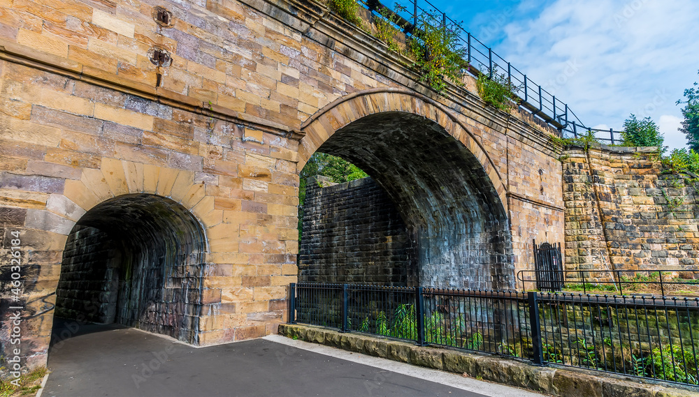 A view towards the Skerne bridge the oldest railway bridge still in use in Darlington, Yorkshire, UK in summertime A view towards the Skerne bridge the oldest railway bridge still in use in Darlington, Yorkshire, UK in summertime