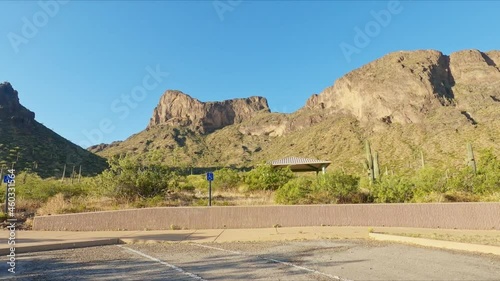 Driving Along The Road Passing By Picacho Peak At Sunny Day In Pinal County, Arizona USA. POV photo