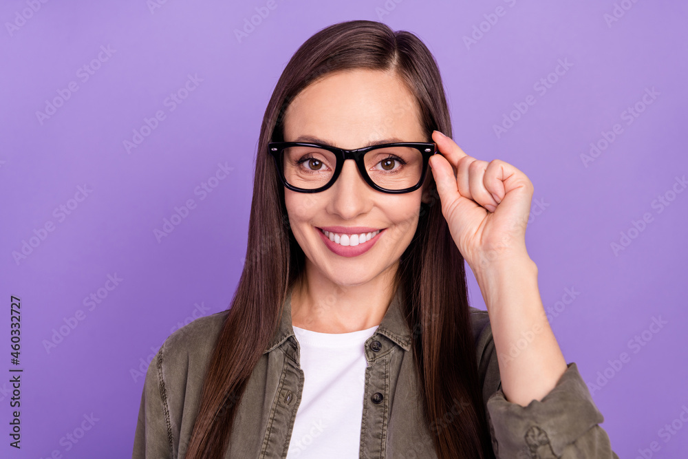 Photo of smiling cheerful lovely mature businesswoman wear spectacles intelligent isolated on purple color background