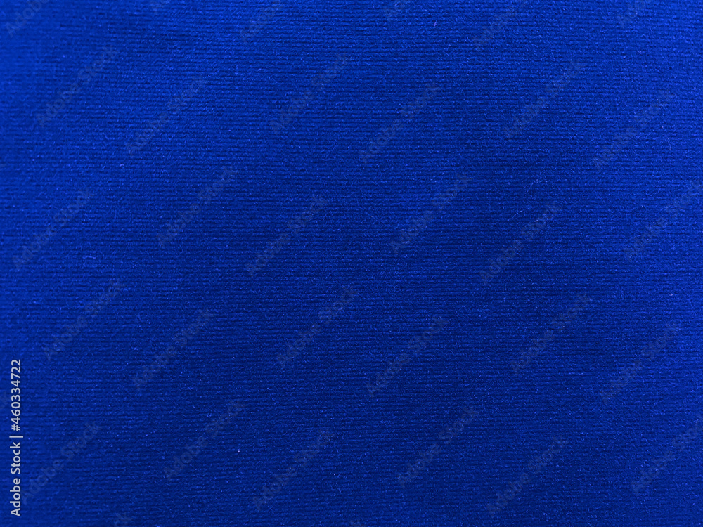 Blue  velvet fabric texture used as background. Empty blue fabric background of soft and smooth textile material. There is space for text.