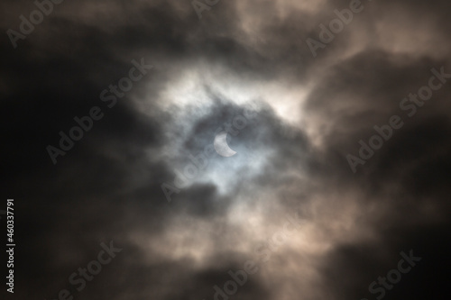 Solar Eclipse dark moody skies sun and moon blue and black stormy 2015