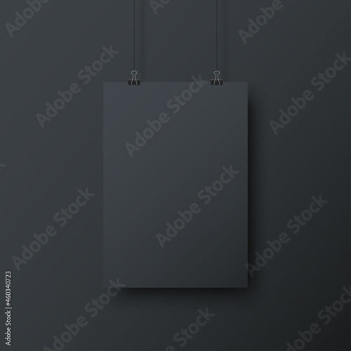 Realistic blank black paper hanging on office clip isolated on dark grey background. Mockup template for design. Vertical empty A4 sheet with shadow. Show your flyers, brochures, headlines. Vector