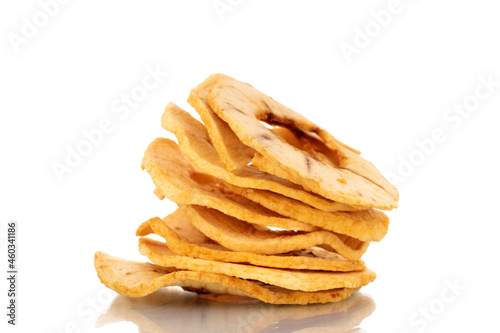 Several organic apple chips, close-up, isolated on white.