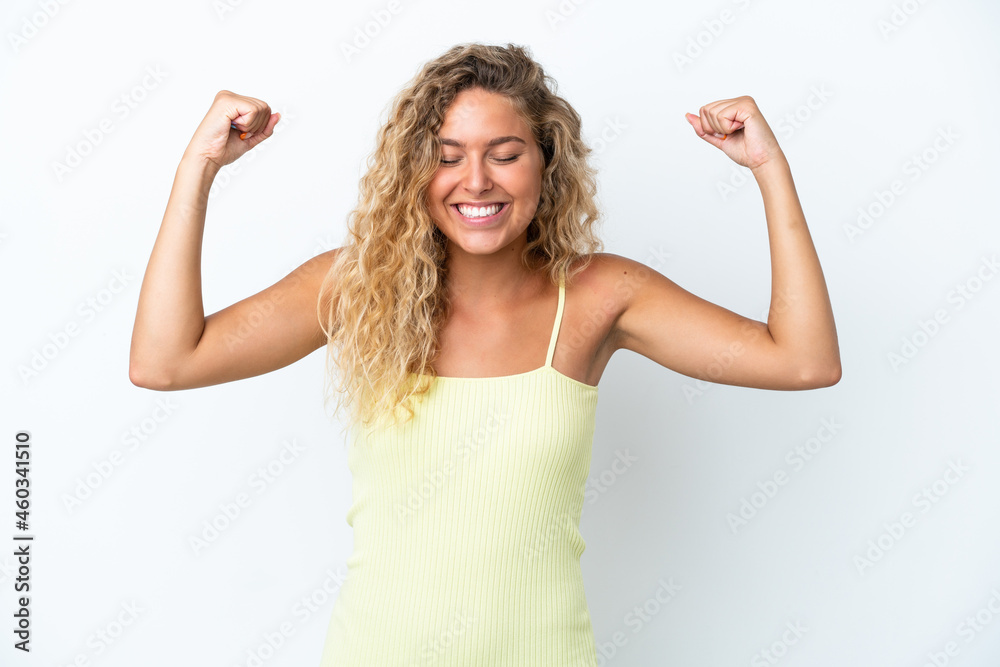 Girl with curly hair isolated on white background doing strong gesture Girl with curly hair isolated on white background doing strong gesture