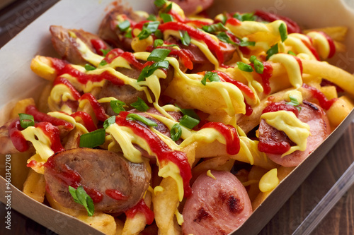 salchipapa, salchipapas traditional street food from Peru with sausages and french fries
