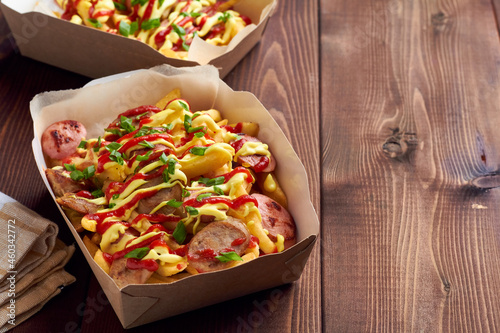 salchipapa, salchipapas traditional street food from Peru with sausages and french fries