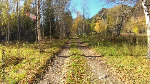 Video of driving along muddy mountain road along Altai river Kumir in Autumn. photo