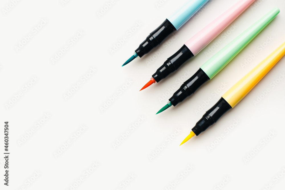 Colored markers on a white background. Stationery.