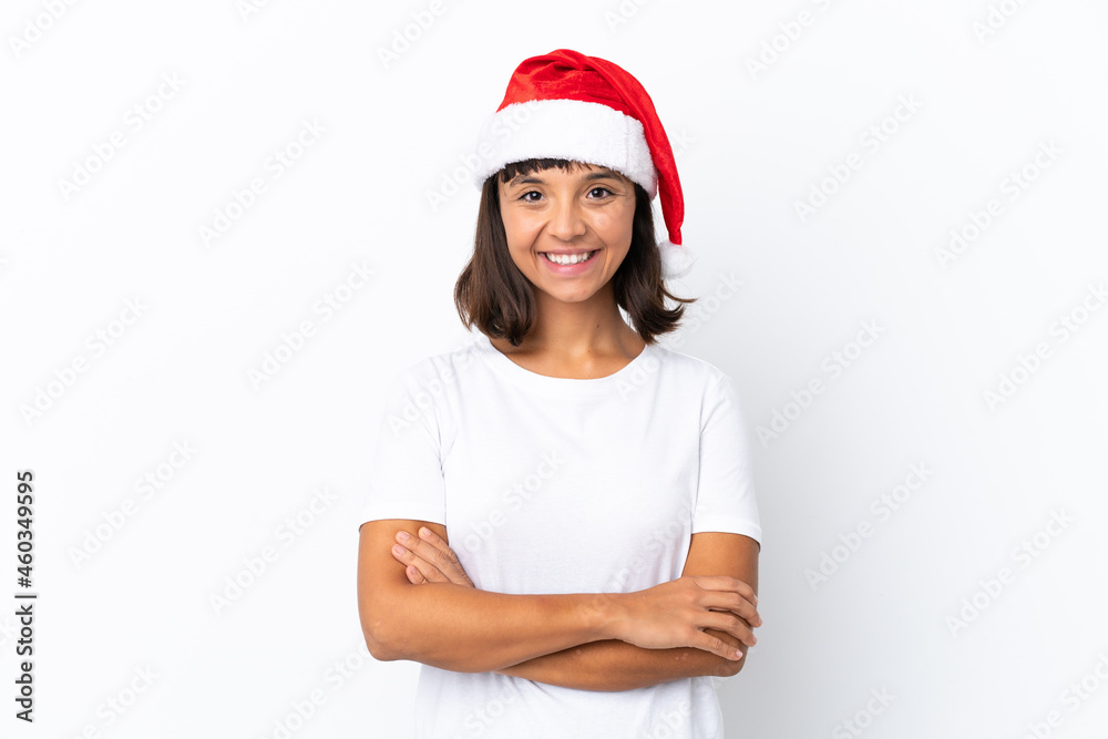 Young mixed race woman celebrating Christmas isolated on white background keeping the arms crossed in frontal position Young mixed race woman celebrating Christmas isolated on white background keeping the arms crossed in frontal position
