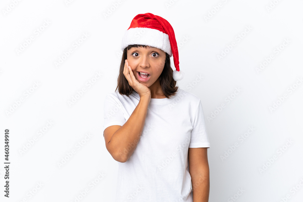 Young mixed race woman celebrating Christmas isolated on white background with surprise and shocked facial expression Young mixed race woman celebrating Christmas isolated on white background with surprise and shocked facial expression