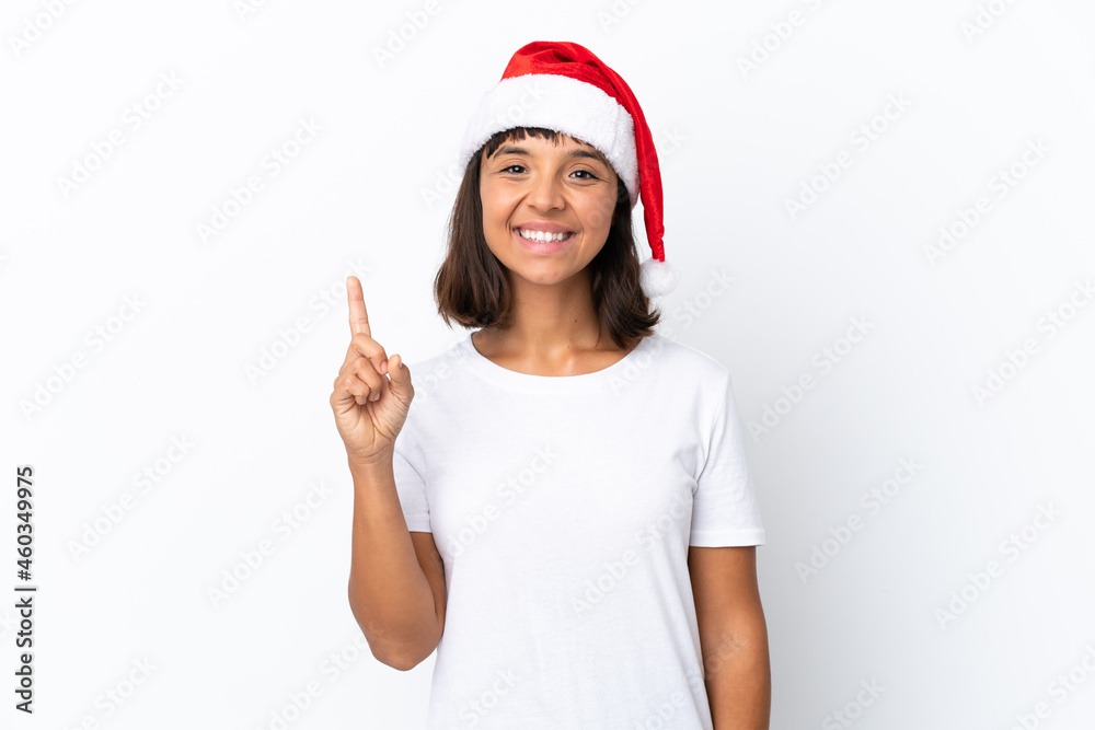 Young mixed race woman celebrating Christmas isolated on white background showing and lifting a finger in sign of the best Young mixed race woman celebrating Christmas isolated on white background showing and lifting a finger in sign of the best