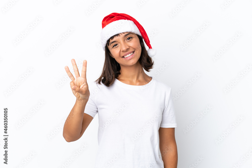 Young mixed race woman celebrating Christmas isolated on white background happy and counting three with fingers Young mixed race woman celebrating Christmas isolated on white background happy and counting three with fingers