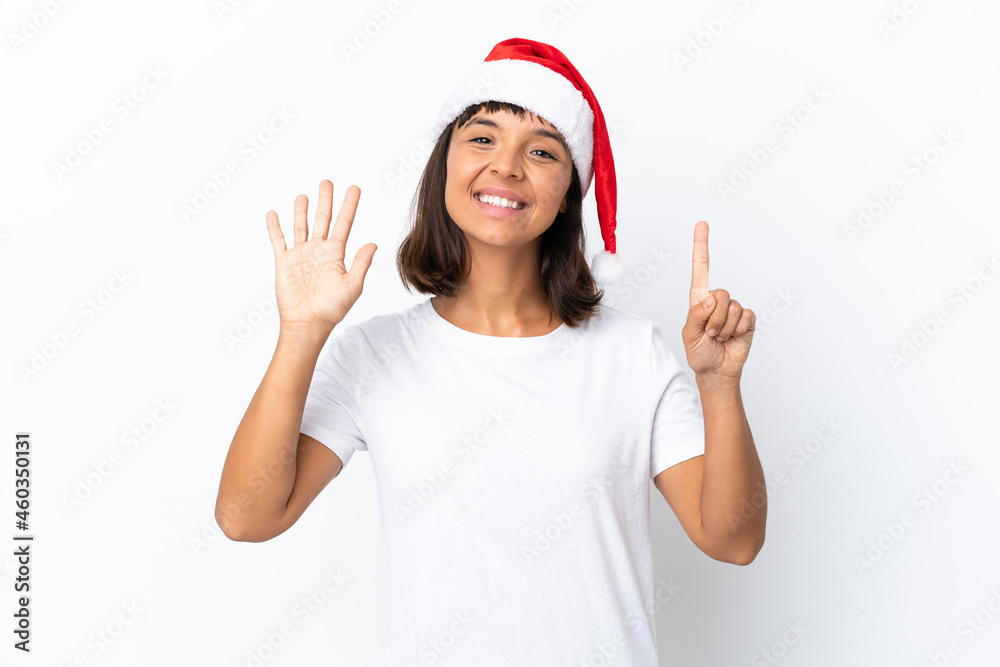 Young mixed race woman celebrating Christmas isolated on white background counting six with fingers