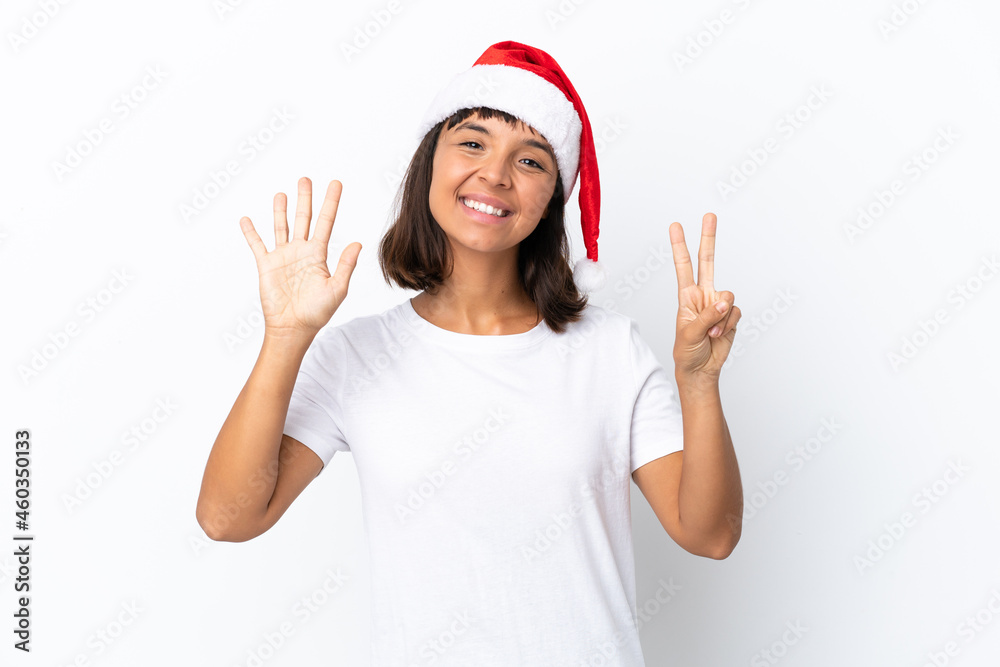Young mixed race woman celebrating Christmas isolated on white background counting seven with fingers Young mixed race woman celebrating Christmas isolated on white background counting seven with fingers