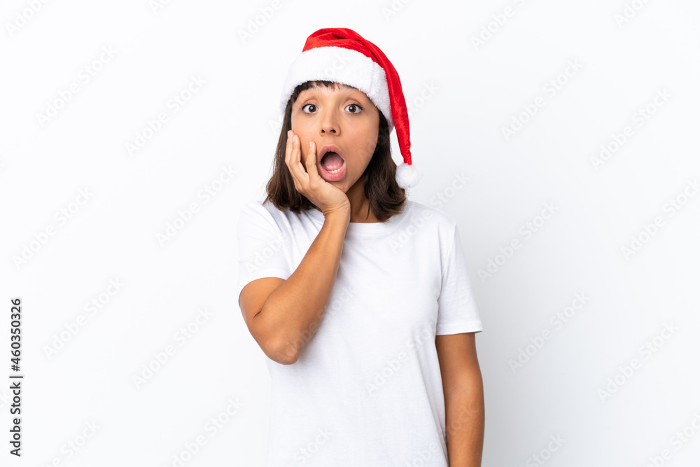 Young mixed race woman celebrating Christmas isolated on white background surprised and shocked while looking right Young mixed race woman celebrating Christmas isolated on white background surprised and shocked while looking right