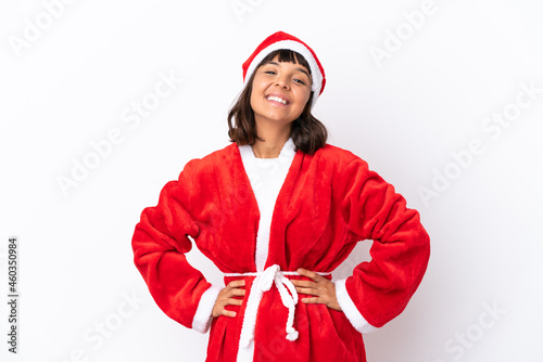 Young mixed race woman disguised as Santa Claus isolated on white background posing with arms at hip and smiling