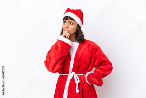 Young mixed race woman disguised as Santa Claus isolated on white background having doubts and with confuse face expression
