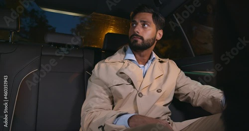 Wallpaper Mural Handsome young businessman smiling sitting on backseat of car Torontodigital.ca