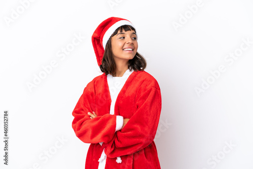 Young mixed race woman disguised as Santa Claus isolated on white background with arms crossed and happy