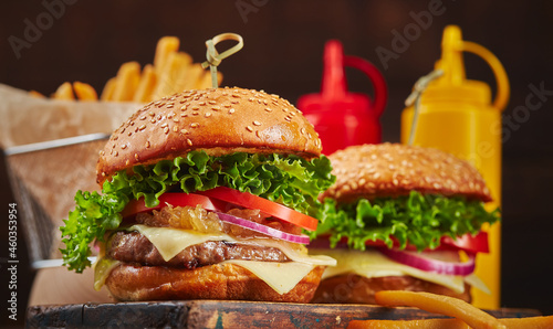 Appetizing homemade burger with beef  cheese and onion marmalade close-up. Fast food concept  american food