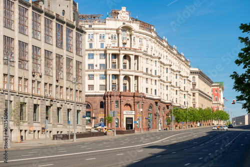 Moscow, View on Tverskaya Street. Russian neoclassical & eclectic architecture and urban car traffic on an early summer morning