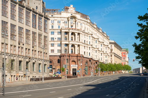 Moscow, View on Tverskaya Street. Russian neoclassical & eclectic architecture and urban car traffic on an early summer morning