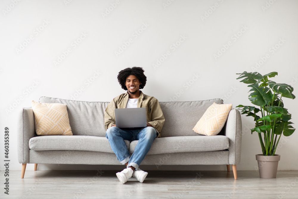 Freelance Concept. Handsome African American Guy Working With Laptop At Home Freelance Concept. Handsome African American Guy Working With Laptop At Home