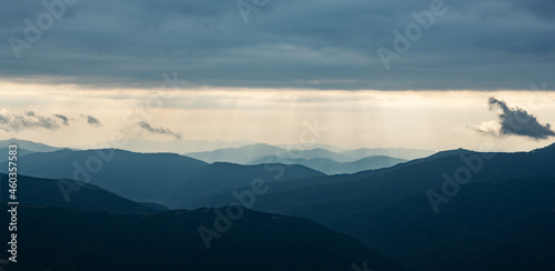 Morning sunlight in spring mountains. Beautiful sun rays on background. Panorama. Landscape photography © Ivan Kmit
