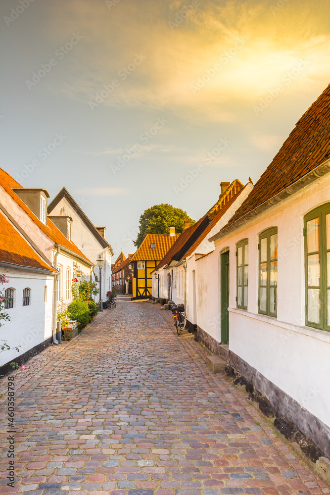 Sunset over a narrow historic street in Ribe, Denmark