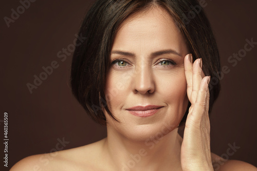 Beautiful middle aged woman with clean wrinkled skin