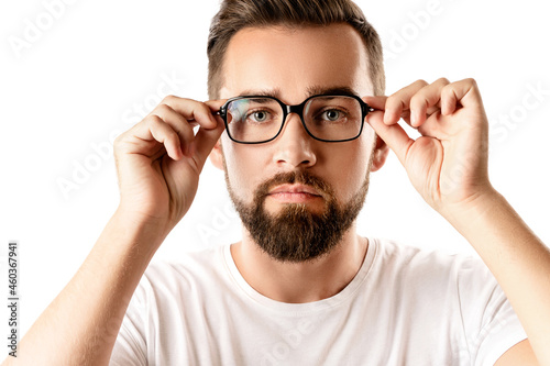 Young and handsome bearded man wearing eyeglasses