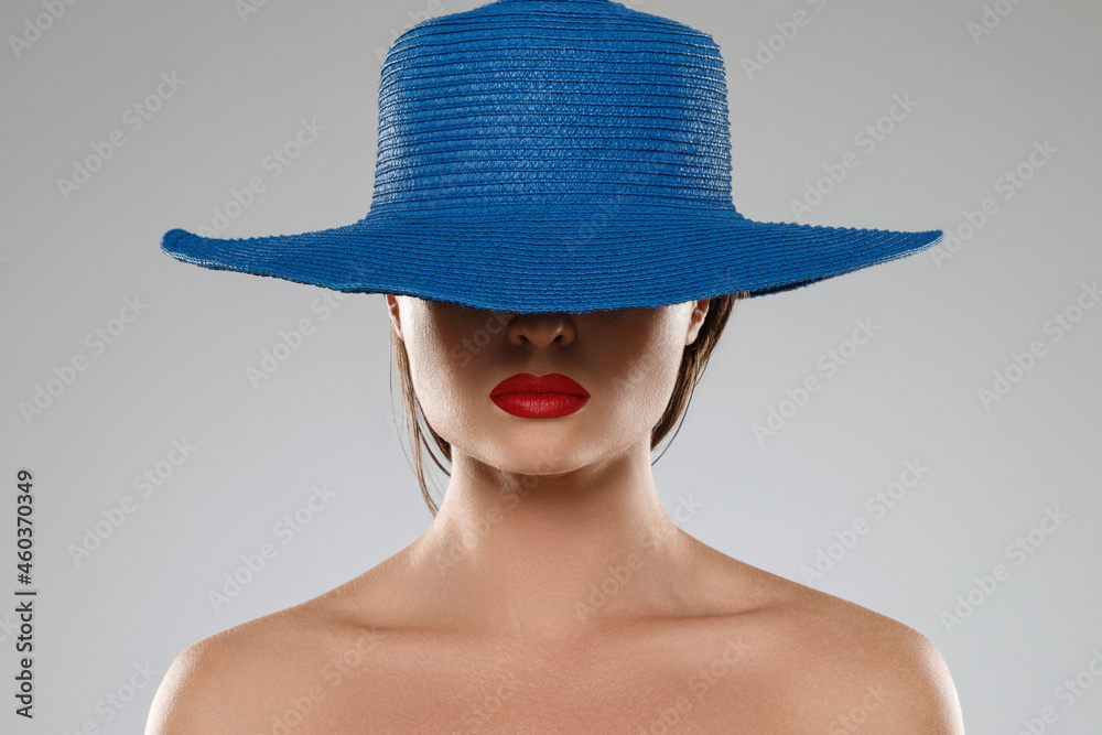 Portrait of stranger girl with red lips wearing blue hat Portrait of stranger girl with red lips wearing blue hat