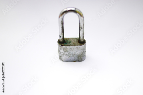 Old used padlock isolated on white background