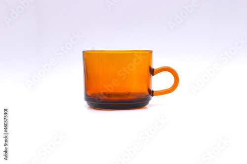 Empty brown tea cup isolated on white background