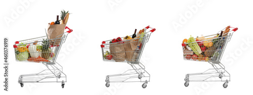 Φωτογραφία Set with shopping carts full of groceries on white background