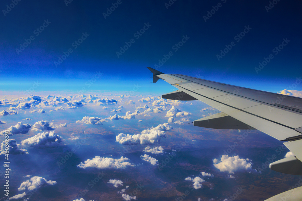 Obraz premium airplane wing and clouds