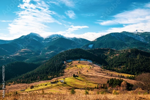 Beautiful forests covering the Carpathian mountains and a small village