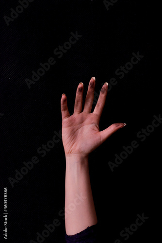 Woman with raised dirty hand