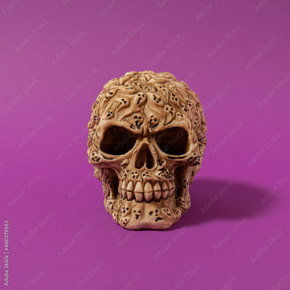 Halloween skull with shadows against bold purple background. modern abstract art. modern concept. minimalism. Halloween skull with shadows against bold purple background. modern abstract art. modern concept. minimalism.