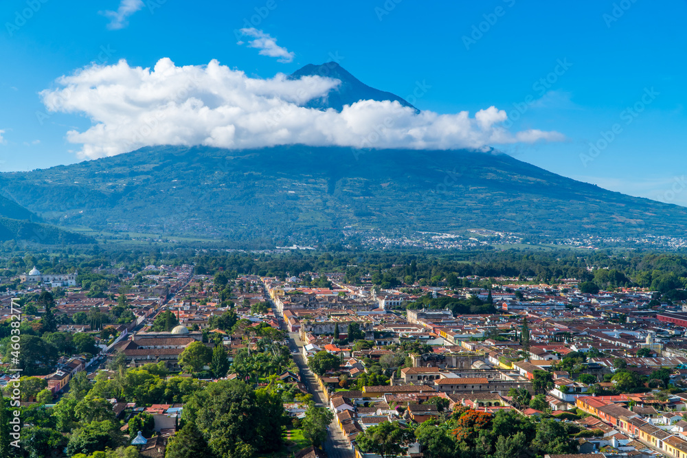 Panoramic aerial view of the city of Antigua, Guatemala with Agua Volcano in the background on a sunny day