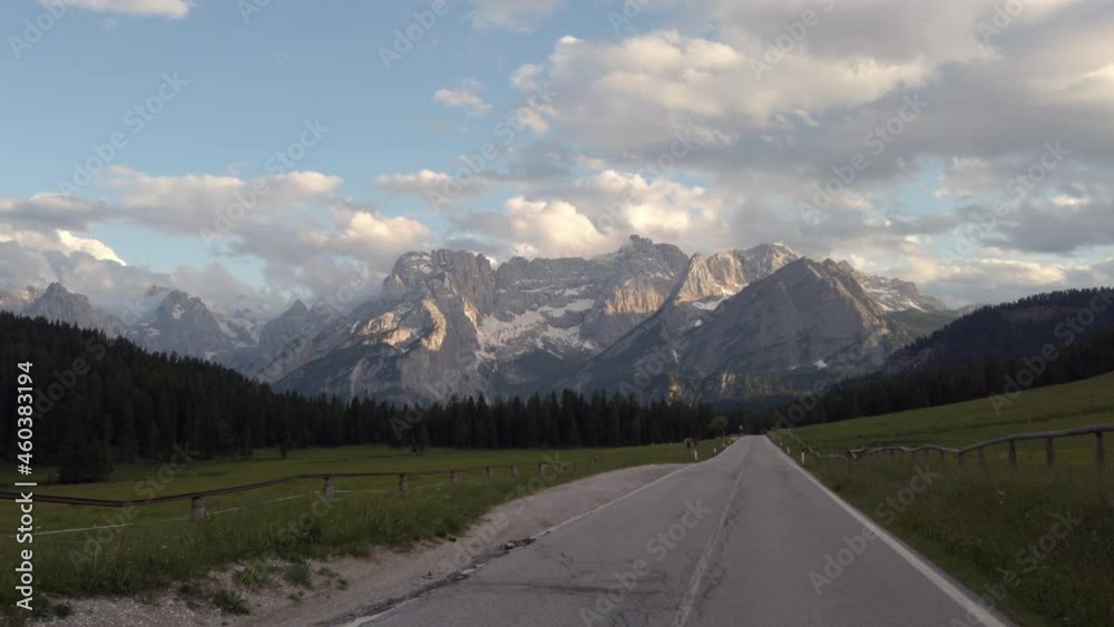 Driving on country road with magnificent view of the Alps ad dusk, 4k time lapse video footage