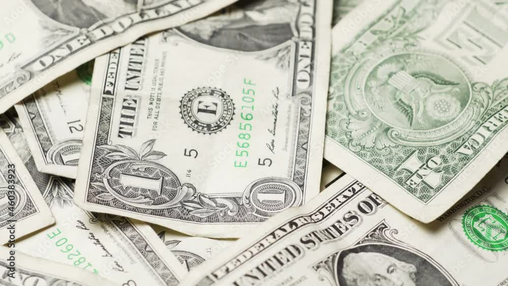 One dollar bills close up video, can represent economy, inflation, abundance or the us government One dollar bills close up video, can represent economy, inflation, abundance or the us government
