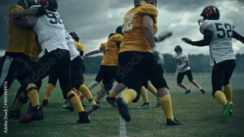 American Football Championship Start Teams Ready: Professional Players, Aggressive Face-off, Start Pushing, Tackling. Competition Full of Brutal Energy, Power. Cinematic Slow Motion, Dramatic Light