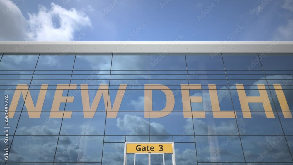 Plane reflects in the airport terminal with NEW DELHI city name Plane reflects in the airport terminal with NEW DELHI city name