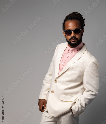 afro cuban with dreadlocks in suit