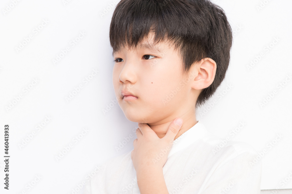 Young boy feels that his throat is pain. Young boy feels that his throat is pain.
