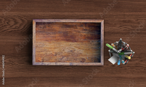 empty wooden box with stationery items like pen pencil ruler on wooden table with copy space