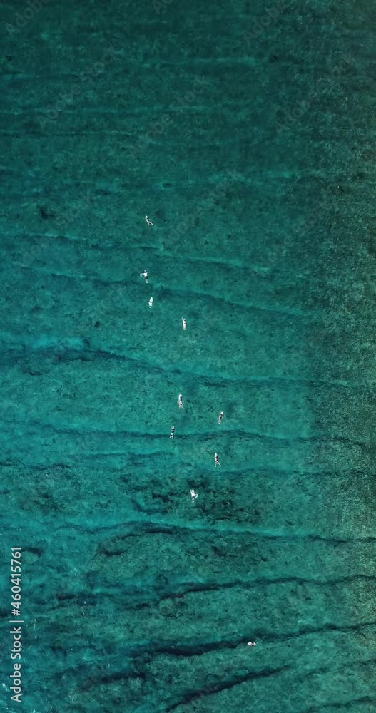 Aerial view of surfers on sea waves, Maldives. High quality 4k footage Aerial view of surfers on sea waves, Maldives. High quality 4k footage