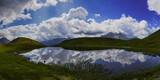 green nature landscape and a amazing mountain lake with reflections panorama