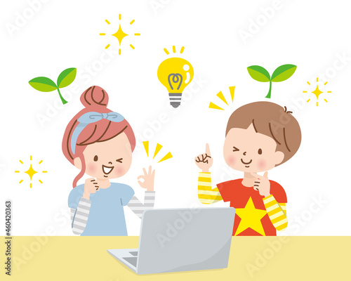 パソコンで仲良く一緒に勉強する子供達